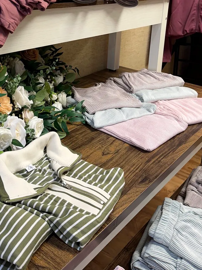Folded ribbed sets in pink, sage and lilac on the display bench